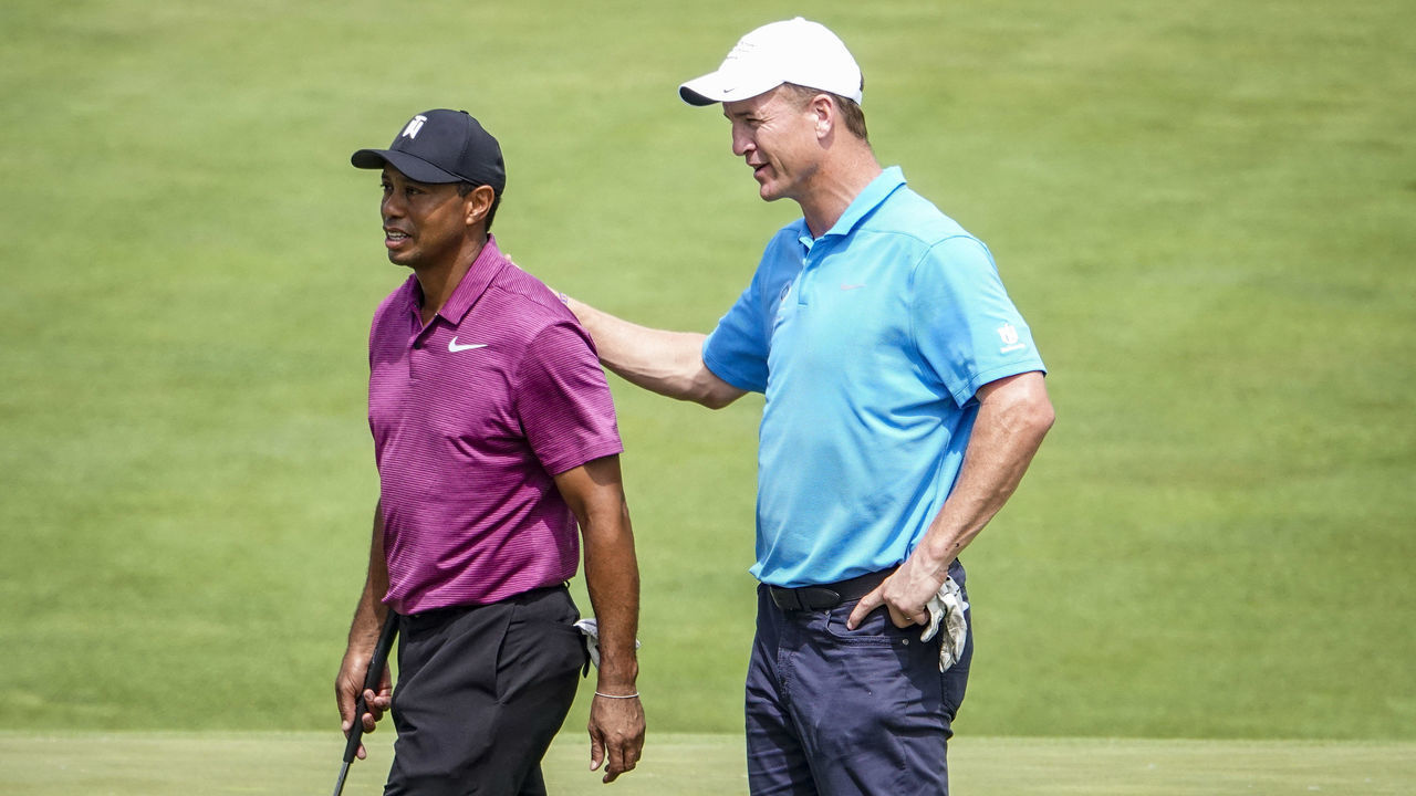 DUBLIN, OH - MAY 30: Tiger Woods and Peyton Manning walk off the course after completing their pro-am round for to the Memorial Tournament presented by Nationwide at Muirfield Village Golf Club on May 30, 2018 in Dublin, Ohio.
