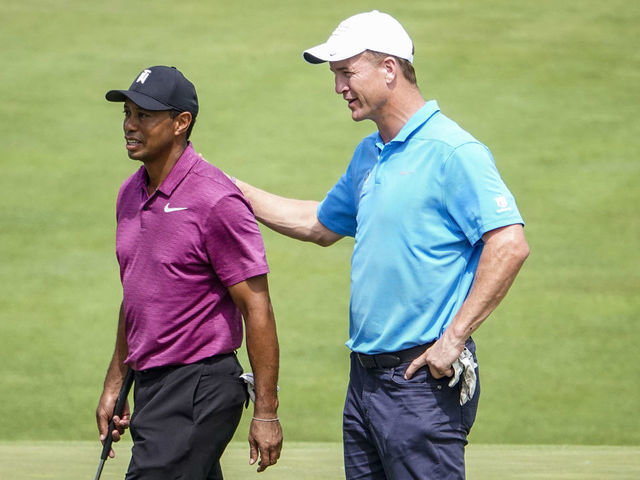 DUBLIN, OH - MAY 30: Tiger Woods and Peyton Manning walk off the course after completing their pro-am round for to the Memorial Tournament presented by Nationwide at Muirfield Village Golf Club on May 30, 2018 in Dublin, Ohio.