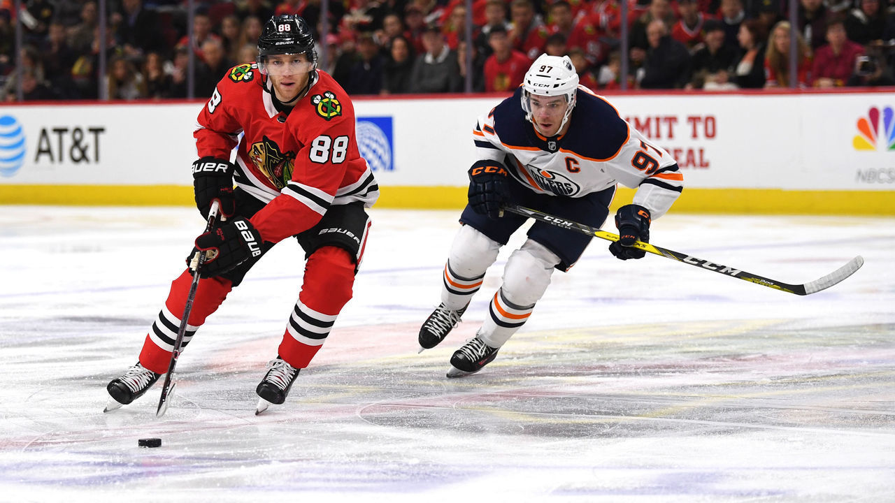 CHICAGO, IL - JANUARY 07: Chicago Blackhawks right wing Patrick Kane (88) controls the puck against Edmonton Oilers center Connor McDavid (97) during the first period during a game between the Chicago Blackhawks and the Edmonton Oilers on January 7, 2018, at the United Center in Chicago, IL.