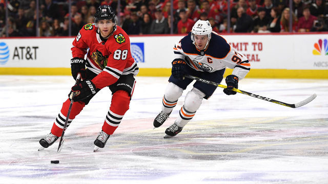 CHICAGO, IL - JANUARY 07: Chicago Blackhawks right wing Patrick Kane (88) controls the puck against Edmonton Oilers center Connor McDavid (97) during the first period during a game between the Chicago Blackhawks and the Edmonton Oilers on January 7, 2018, at the United Center in Chicago, IL.