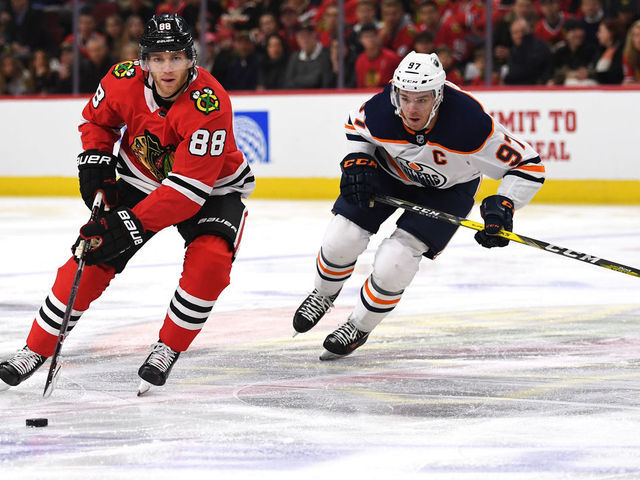 CHICAGO, IL - JANUARY 07: Chicago Blackhawks right wing Patrick Kane (88) controls the puck against Edmonton Oilers center Connor McDavid (97) during the first period during a game between the Chicago Blackhawks and the Edmonton Oilers on January 7, 2018, at the United Center in Chicago, IL.