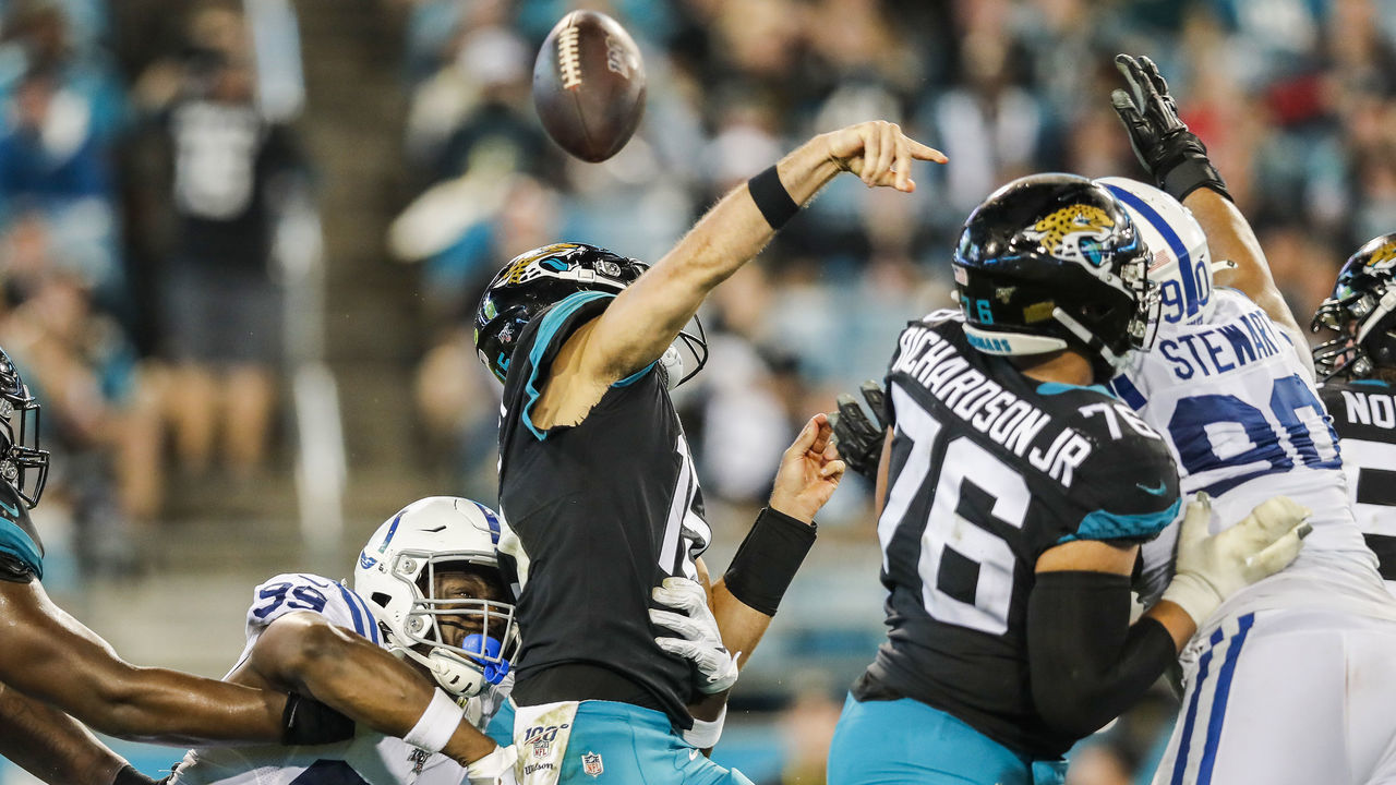 JACKSONVILLE, FLORIDA - DECEMBER 29: Justin Houston #99 of the Indianapolis Colts forces a fumble by Gardner Minshew II #15 of the Jacksonville Jaguars during the third quarter of a game at TIAA Bank Field on December 29, 2019 in Jacksonville, Florida.