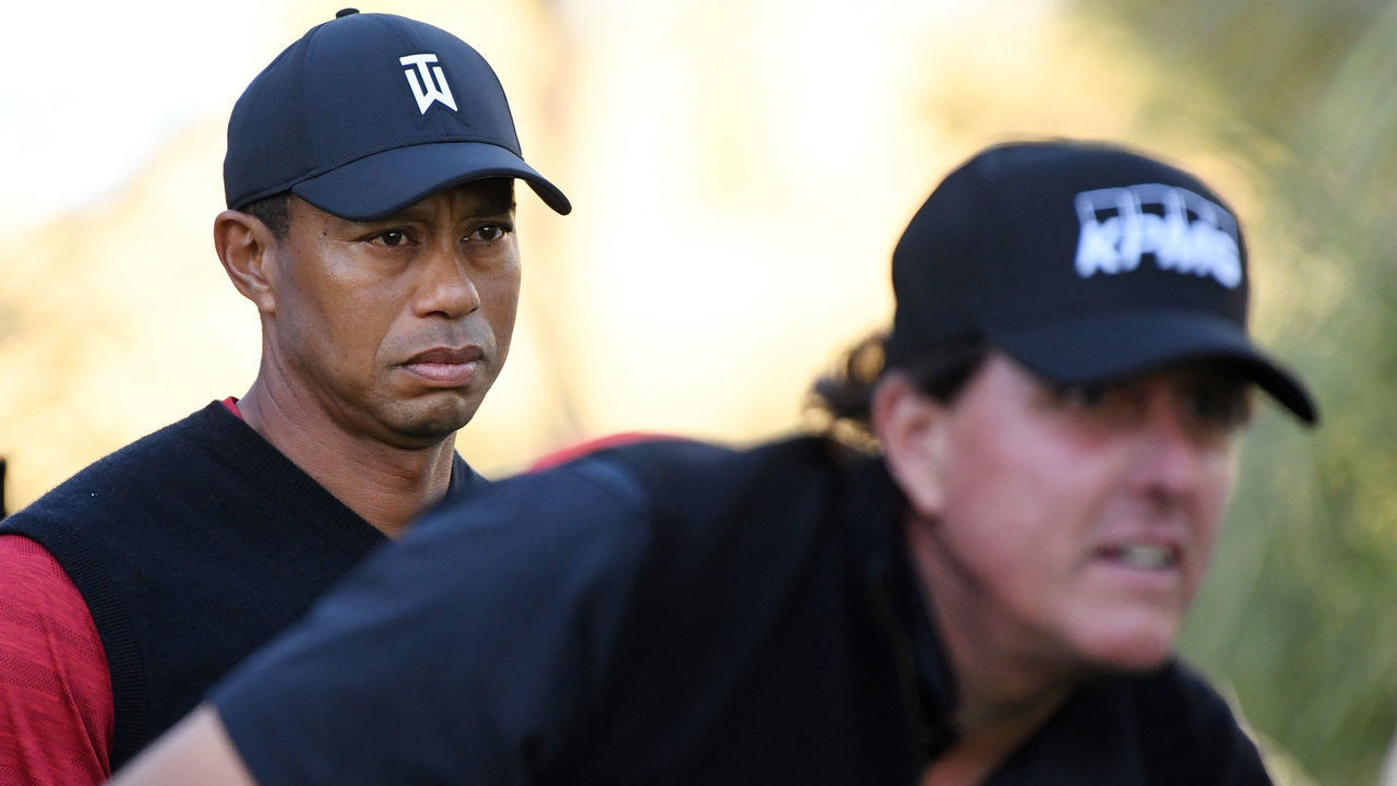 LAS VEGAS, NV - NOVEMBER 23: Tiger Woods looks on as Phil Mickelson plays from the 14th tee during The Match: Tiger vs Phil at Shadow Creek Golf Course on November 23, 2018 in Las Vegas, Nevada.