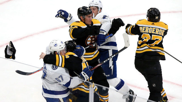 BOSTON - MARCH 7: Players fight in the third period. The Boston Bruins host the Tampa Bay Lightning in an NHL hockey game at TD Garden in in Boston on March 7, 2020.