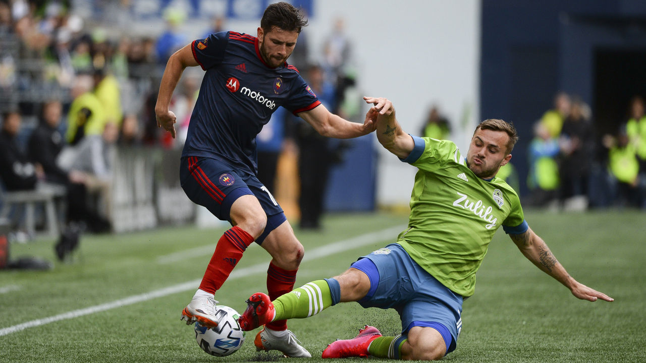 SEATTLE, WA - MARCH 01: Seattle Sounders Jordan Morris (13) slide tackles Chicago Fire Brandt Bronico (13) during a MLS match between the Chicago Fire and the Seattle Sounders at Century Link Field in Seattle, WA.