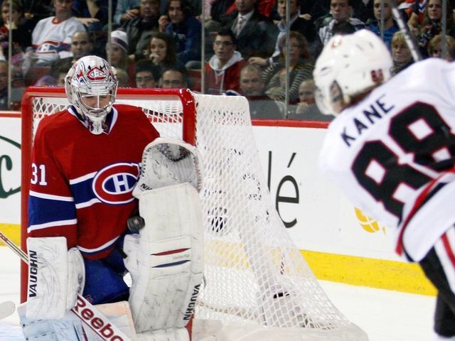 MONTREAL, CANADA - APRIL 5: Carey Price #31 of the Montreal Canadiens stops the puck on a shot by Patrick Kane #88 of the Chicago Blackhawks during the NHL game at the Bell Centre on April 5, 2011 in Montreal, Quebec, Canada. The Canadiens defeated the Blackhawks 2-1 in overtime.