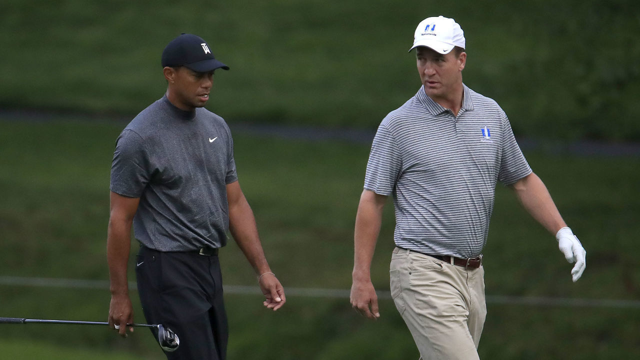 DUBLIN, OHIO - MAY 29: Tiger Woods and Peyton Manning walk down the fairway on the first hole during the Pro -Am of The Memorial Tournament presented by Nationwide at Muirfield Village Golf Club on May 29, 2019 in Dublin, Ohio.