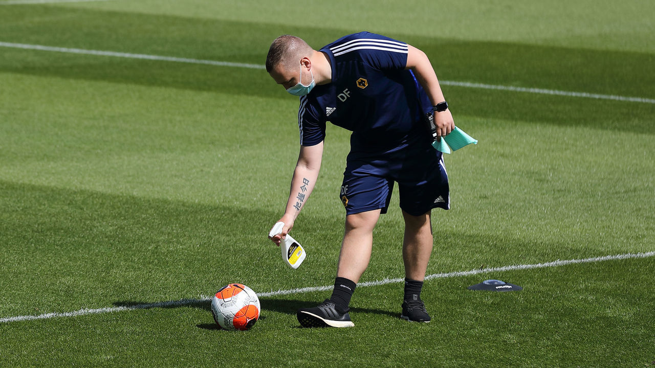 WOLVERHAMPTON, ENGLAND - MAY 20: A English Premier League Nike Ball is sprayed with disinfectant during a training session at Sir Jack Hayward Training Ground on May 20, 2020 in Wolverhampton, England.