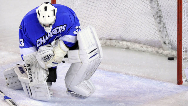 Chargers goalie Clarke Saunders (33) slumped in front of his net after allowing a puck bounce over his stick in the second period. The University of Denver hockey team hosted Alabama-Huntsville at Magness Arena Saturday night, January 7, 2012. Karl Gehring/The Denver Post