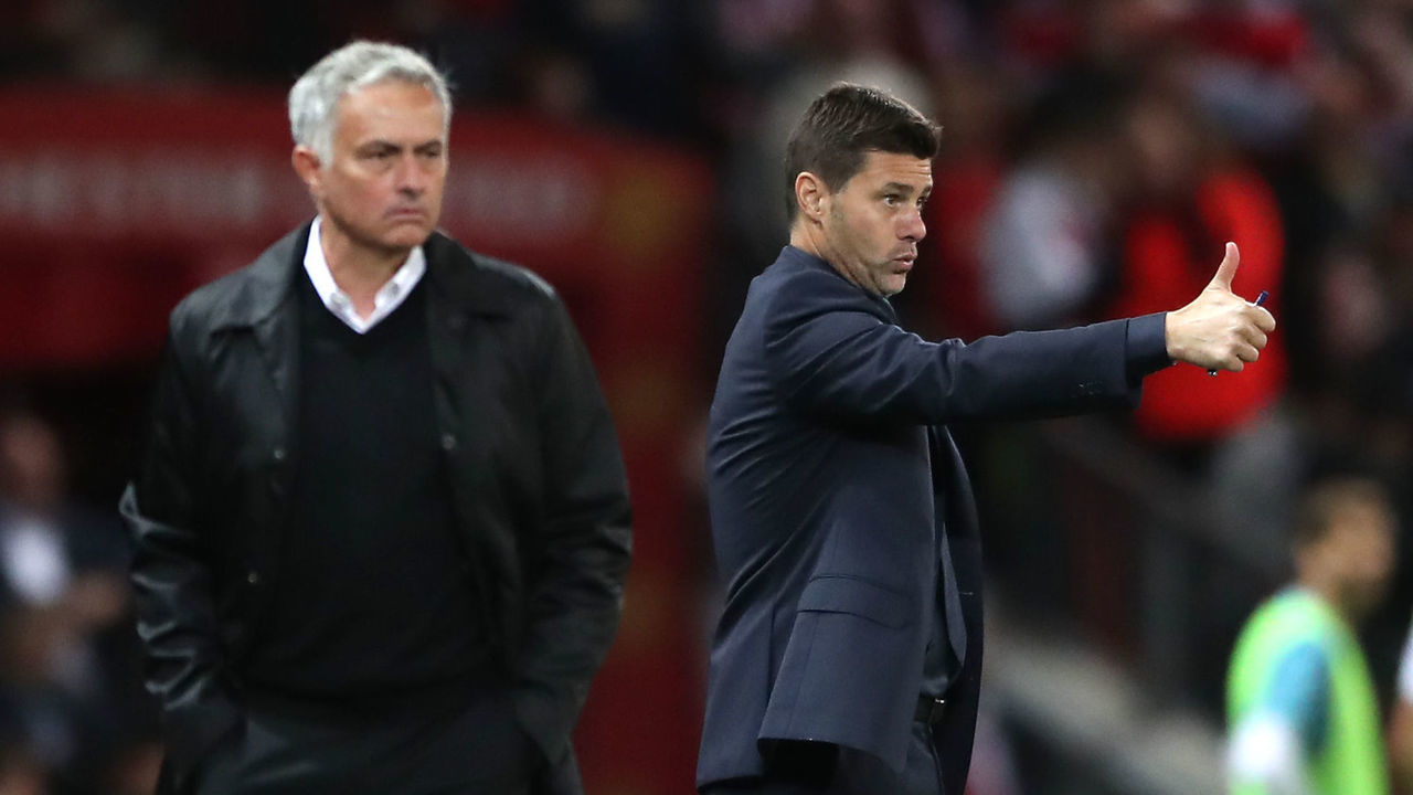 Manchester United manager Jose Mourinho (left) and Tottenham Hotspur manager Mauricio Pochettino during the Premier League match at Old Trafford, Manchester.