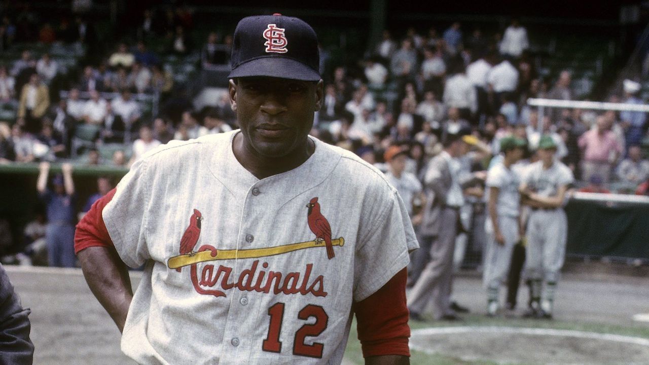 CIRCA 1960's: First Baseman Bill White #12 of the St. Louis Cardinals waiting his turn to hit during batting practice before a circa 1960's Major League Baseball game. White played for the Cardinals from 1959-65 and 1969.