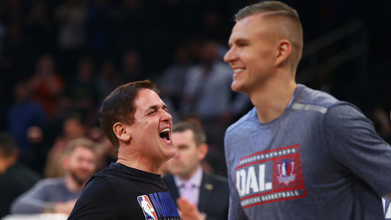 NEW YORK, NEW YORK - NOVEMBER 14: Mark Cuban, owner of the Dallas Mavericks and Kristaps Porzingis #6 looks on prior to the start of the game against the New York Knicks at Madison Square Garden on November 14, 2019 in New York City.