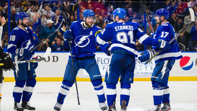 TAMPA, FL - DECEMBER 12: Steven Stamkos #91 of the Tampa Bay Lightning celebrates his goal with teammate Nikita Kucherov #86, Victor Hedman #77, and Alex Killorn #17 against the Boston Bruins during the second period at Amalie Arena on December 12, 2019 in Tampa, Florida.