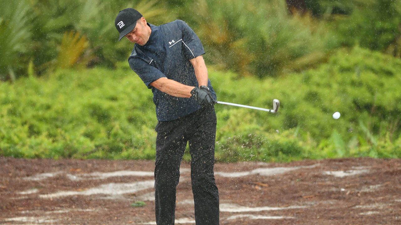 HOBE SOUND, FLORIDA - MAY 24: NFL player Tom Brady of the Tampa Bay Buccaneers plays a shot on the first hole during The Match: Champions For Charity at Medalist Golf Club on May 24, 2020 in Hobe Sound, Florida.