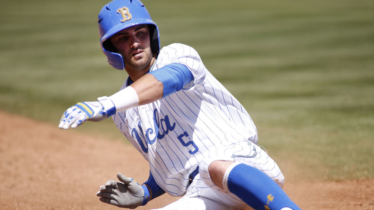 LOS ANGELES, CALIFORNIA - MAY 19: Garrett Mitchell #5 of UCLA slides into third base during a baseball game against University of Washington at Jackie Robinson Stadium on May 19, 2019 in Los Angeles, California.