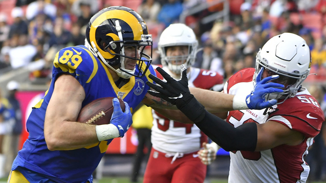 LOS ANGELES, CA - DECEMBER 29: Tyler Higbee #89 of the Los Angeles Rams straight arms Jordan Hicks #58 of the Arizona Cardinals in the second quarter at Los Angeles Memorial Coliseum on December 29, 2019 in Los Angeles, California.