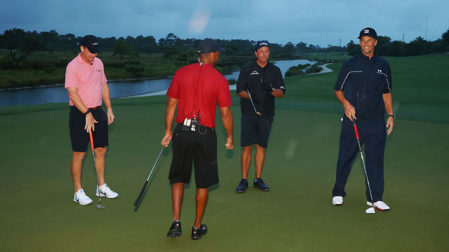 HOBE SOUND, FLORIDA - MAY 24: Tiger Woods and former NFL player Peyton Manning celebrate defeating Phil Mickelson and NFL player Tom Brady of the Tampa Bay Buccaneers on the 18th green during The Match: Champions For Charity at Medalist Golf Club on May 24, 2020 in Hobe Sound, Florida.
