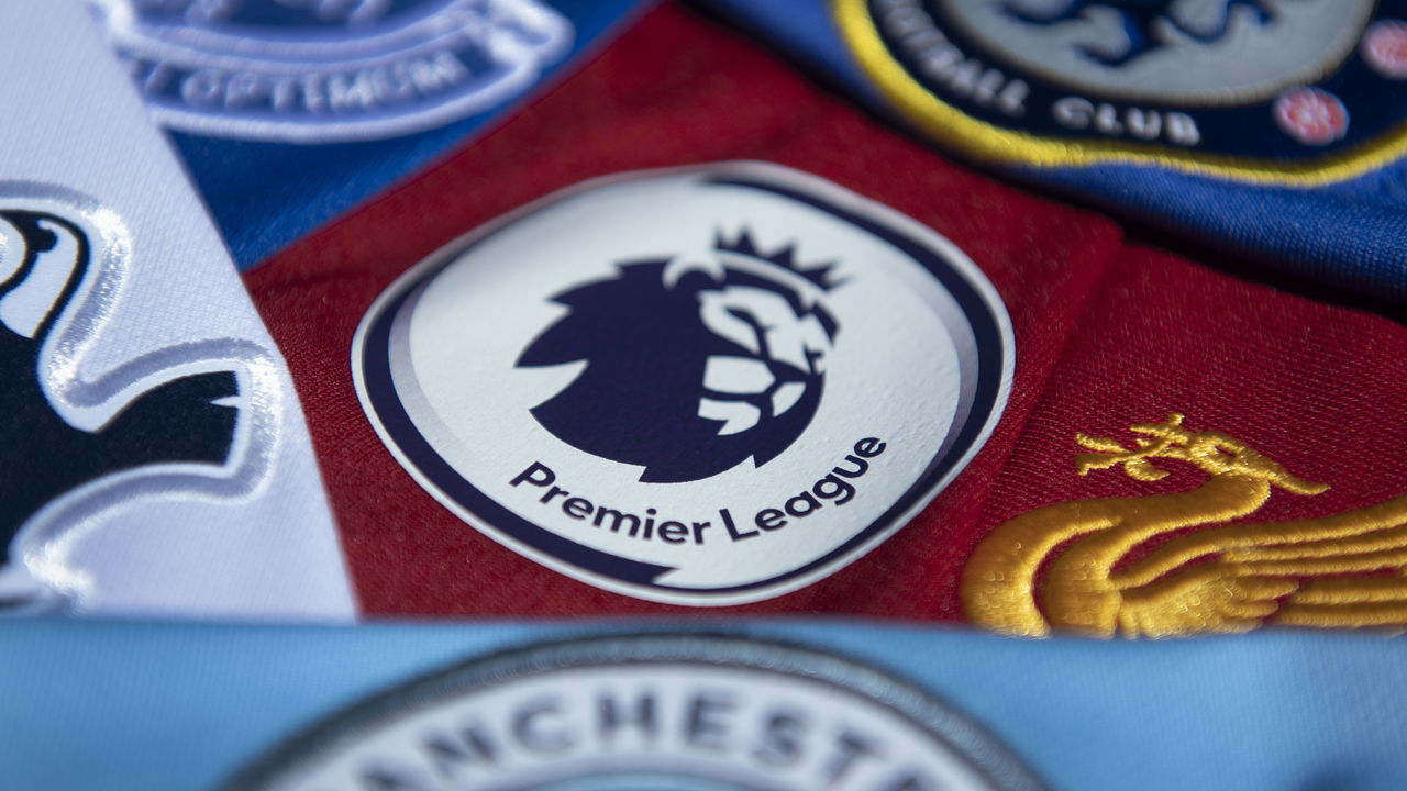 MANCHESTER, ENGLAND - MAY 14: The Premier League logo amongst shirts from Premier League clubs on May 14, 2020 in Manchester, England.