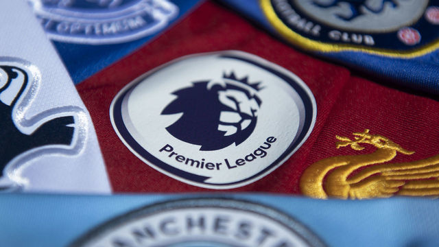 MANCHESTER, ENGLAND - MAY 14: The Premier League logo amongst shirts from Premier League clubs on May 14, 2020 in Manchester, England.