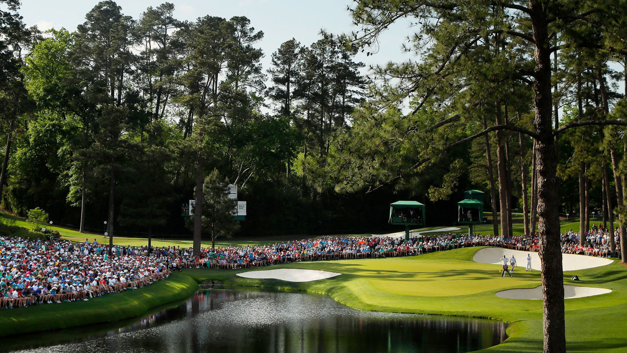 AUGUSTA, GEORGIA - APRIL 13: A general view as Tiger Woods of the United States stands on the 16th green during the third round of the Masters at Augusta National Golf Club on April 13, 2019 in Augusta, Georgia.