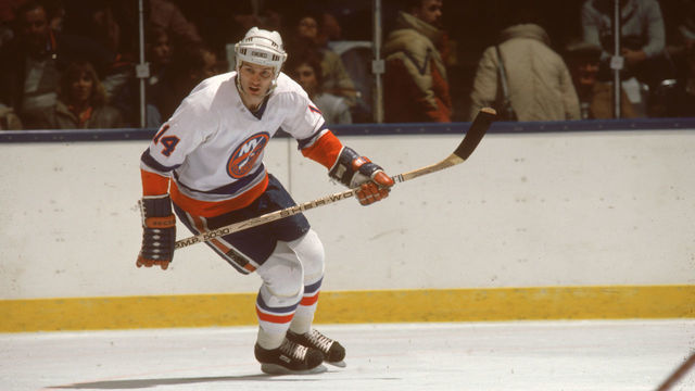 Canadian hockey player Bob Bourne of the New York Islanders skates while he keeps an eye on the action during a home game at Nassau Coliseum, Uniondale, New York, February 1984.