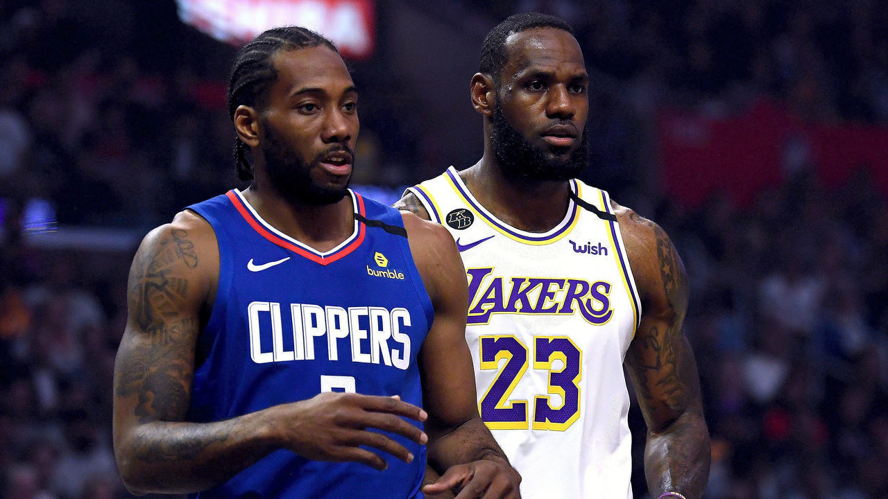 LOS ANGELES, CALIFORNIA - MARCH 08: Kawhi Leonard #2 of the LA Clipper and LeBron James #23 of the Los Angeles Lakers during the first half at Staples Center on March 08, 2020 in Los Angeles, California.