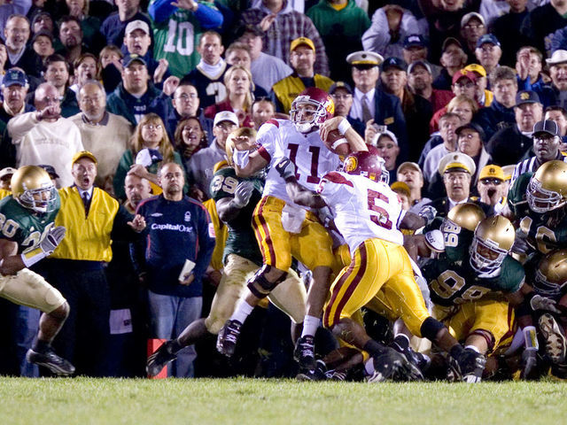 15 Oct 2005: USC quarterback Matt Leinart (11) is pushed in to the endzone by teammate Reggie Bush (5) for a touchdown in the closing moments of the USC Trojans 34-31 victory over the Notre Dame Fighting Irish at Notre Dame Stadium in South Bend, Indiana.
