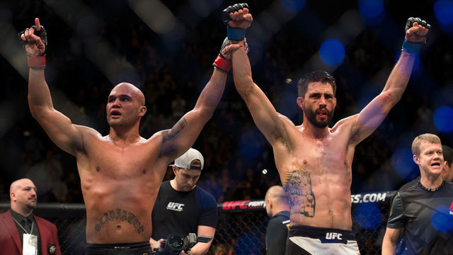 LAS VEGAS, NV - JANUARY 02: (L-R) Robbie Lawler and Carlos Condit raise each others hands after their welterweight championship fight during the UFC 195 event inside MGM Grand Garden Arena on January 2, 2016 in Las Vegas, Nevada.