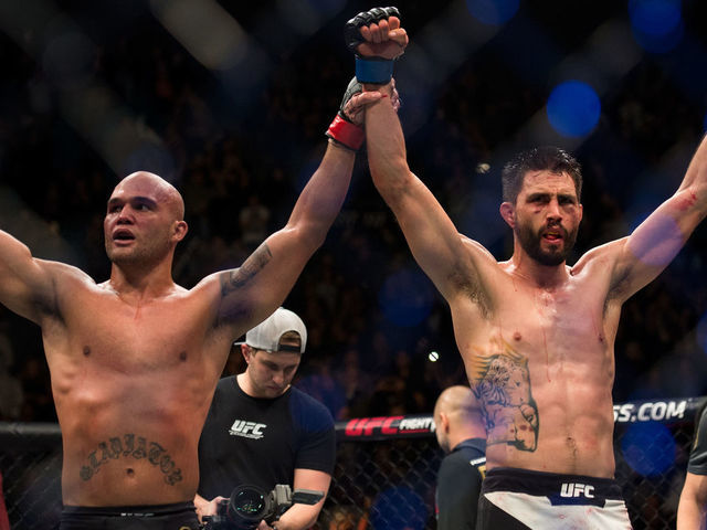 LAS VEGAS, NV - JANUARY 02: (L-R) Robbie Lawler and Carlos Condit raise each others hands after their welterweight championship fight during the UFC 195 event inside MGM Grand Garden Arena on January 2, 2016 in Las Vegas, Nevada.