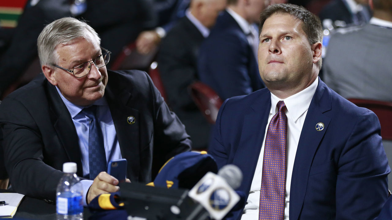 VANCOUVER, BRITISH COLUMBIA - JUNE 21: General manager Jason Botterill (R) of the Buffalo Sabres looks on from the team draft table during the first round of the 2019 NHL Draft at Rogers Arena on June 21, 2019 in Vancouver, Canada.