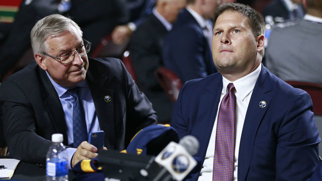 VANCOUVER, BRITISH COLUMBIA - JUNE 21: General manager Jason Botterill (R) of the Buffalo Sabres looks on from the team draft table during the first round of the 2019 NHL Draft at Rogers Arena on June 21, 2019 in Vancouver, Canada.