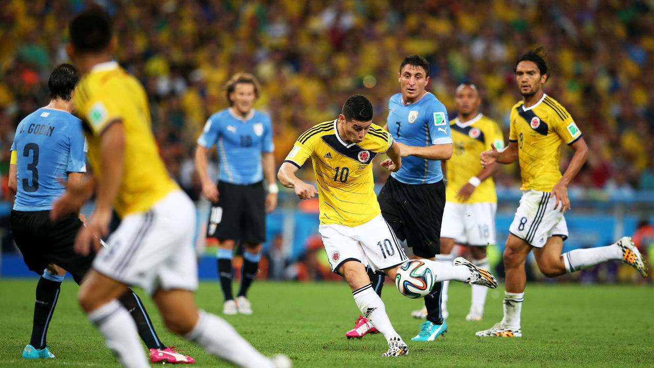 RIO DE JANEIRO, BRAZIL - JUNE 28: James Rodriguez of Colombia shoots and scoores his team's first goal during the 2014 FIFA World Cup Brazil round of 16 match between Colombia and Uruguay at Maracana on June 28, 2014 in Rio de Janeiro, Brazil.