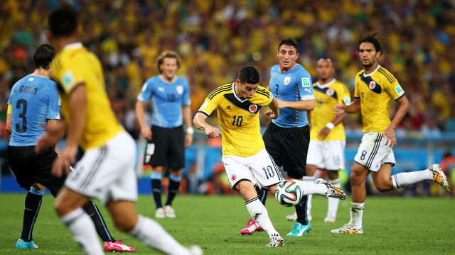 RIO DE JANEIRO, BRAZIL - JUNE 28: James Rodriguez of Colombia shoots and scoores his team's first goal during the 2014 FIFA World Cup Brazil round of 16 match between Colombia and Uruguay at Maracana on June 28, 2014 in Rio de Janeiro, Brazil.