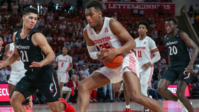 HOUSTON, TX - MARCH 01: Houston Cougars forward Fabian White Jr. (35) keeps the ball away from Cincinnati Bearcats guard Jaevin Cumberland (21) during the college basketball game between the Cincinnati Bearcats and Houston Cougars on March 1, 2020 at Fertitta Center in Houston, Texas.