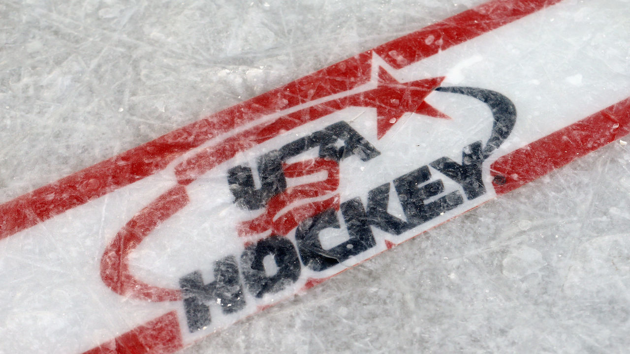 EAGLE RIVER, WI - FEBRUARY 09: A USA Hockey logo is embedded in the ice surface for the 2013 USA Hockey Pond Hockey National Championships on February 9, 2013 in Eagle River, Wisconsin. The three-day tournament features 2,400 participants from 30 states playing a round robin tournament on 28 rinks laid out on Dollar Lake.