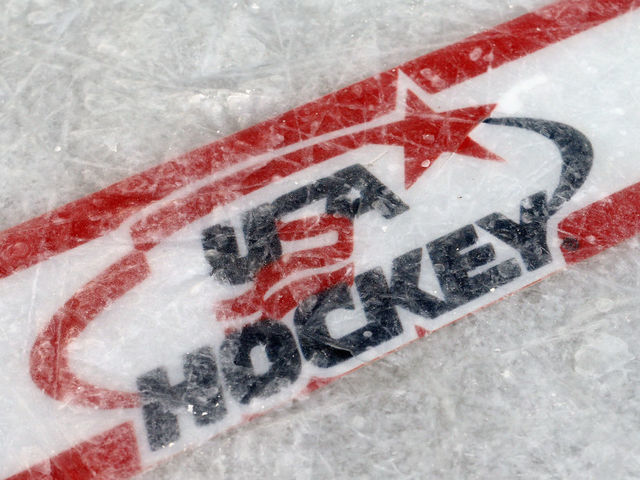 EAGLE RIVER, WI - FEBRUARY 09: A USA Hockey logo is embedded in the ice surface for the 2013 USA Hockey Pond Hockey National Championships on February 9, 2013 in Eagle River, Wisconsin. The three-day tournament features 2,400 participants from 30 states playing a round robin tournament on 28 rinks laid out on Dollar Lake.