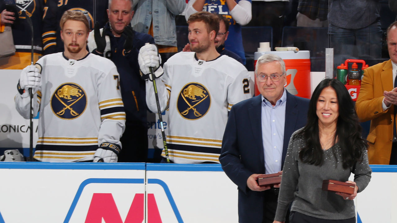 BUFFALO, NY - DECEMBER 2: Buffalo Sabres owners Terry and Kim Pegula take part in a ceremony before an NHL game against the New Jersey Devils on December 2, 2019 at KeyBank Center in Buffalo, New York.