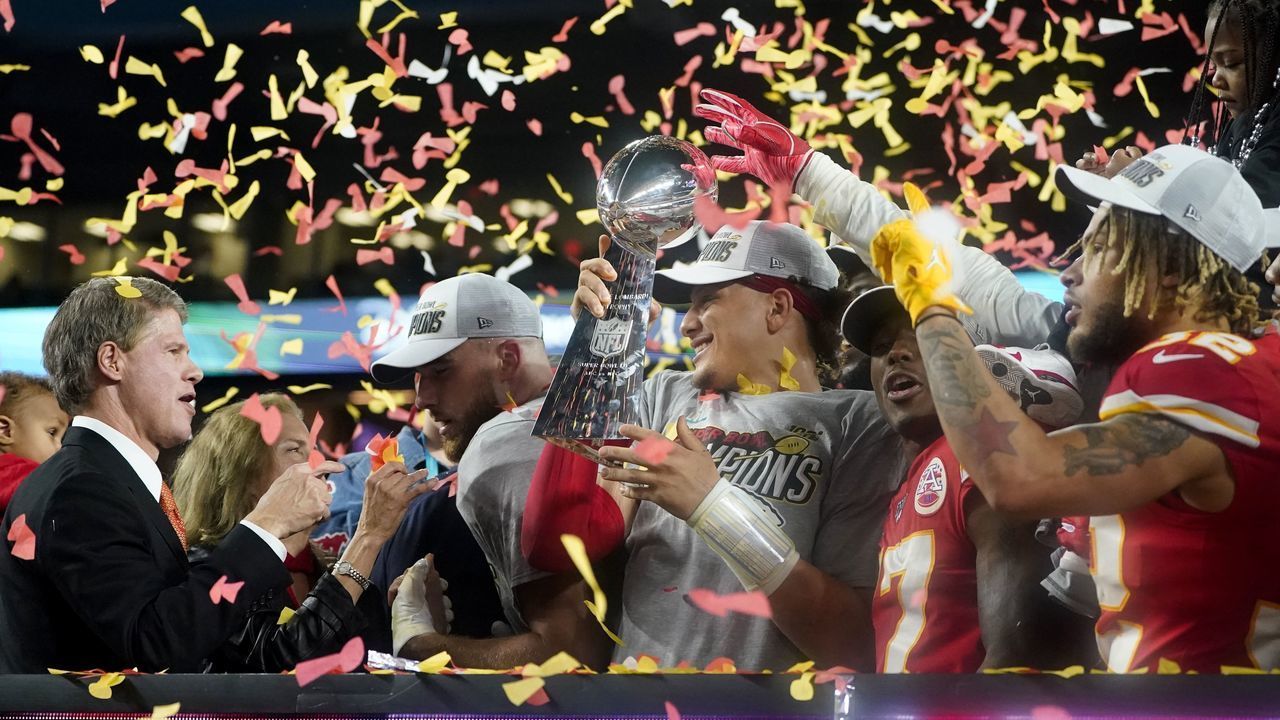 (L-R) CEO of the Kansas City Chiefs Clark Hunt, Tight End Travis Kelce, Quarterback Patrick Mahomes (holding the Lombardi trophy), Wide receiver Mecole Hardman and Strong safety Tyrann Mathieu celebrate after winning Super Bowl LIV between the Kansas City Chiefs and the San Francisco 49ers at Hard Rock Stadium in Miami Gardens, Florida, on February 2, 2020.