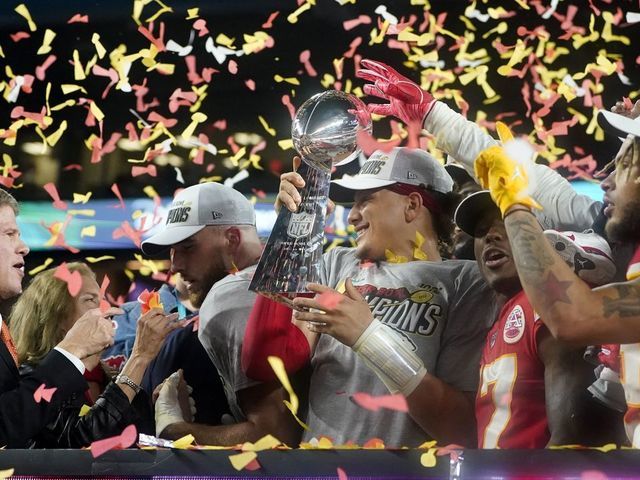 (L-R) CEO of the Kansas City Chiefs Clark Hunt, Tight End Travis Kelce, Quarterback Patrick Mahomes (holding the Lombardi trophy), Wide receiver Mecole Hardman and Strong safety Tyrann Mathieu celebrate after winning Super Bowl LIV between the Kansas City Chiefs and the San Francisco 49ers at Hard Rock Stadium in Miami Gardens, Florida, on February 2, 2020.
