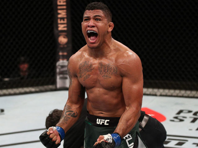 BRASILIA, BRAZIL - MARCH 14: Gilbert Burns of Brazil celebrates after his TKO victory over Demian Maia of Brazil in their welterweight fight during the UFC Fight Night event on March 14, 2020 in Brasilia, Brazil.