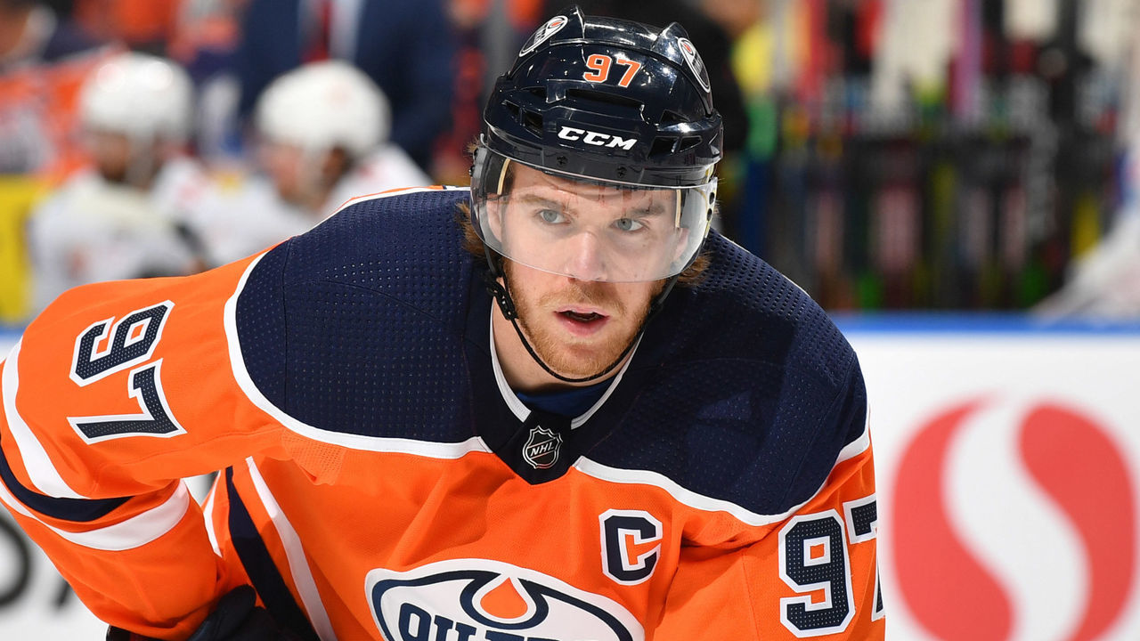 EDMONTON, AB - JANUARY 29: Connor McDavid #97 of the Edmonton Oilers lines up for a face off during the game against the Calgary Flames on January 29, 2020, at Rogers Place in Edmonton, Alberta, Canada.