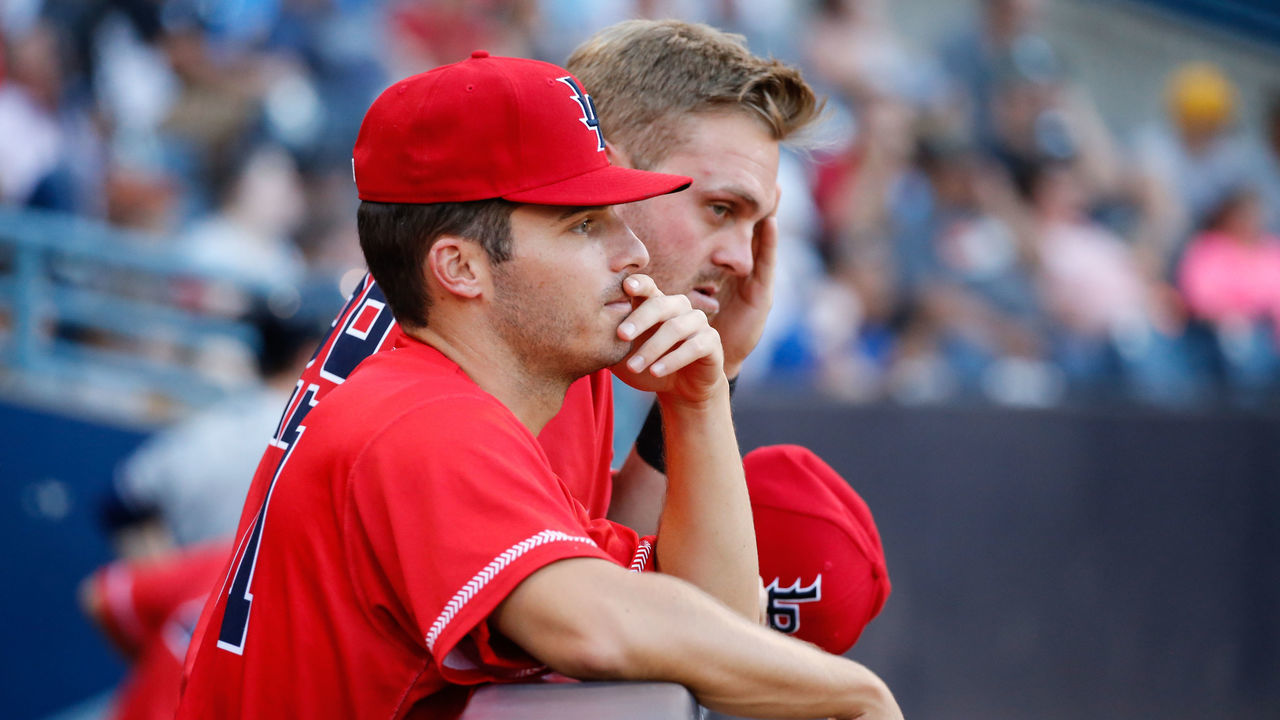 TOLEDO, OH - JULY 30: Louisville Bats pitcher Brad Markey (left front) and Louisville Bats third baseman Mitch Nay (right) watch the action on the field from the dugout during a regular season game between the Louisville Bats and the Toledo Mud Hens on July 30, 2019 at Fifth Third Field in Toledo, Ohio.