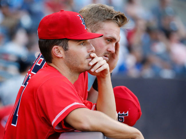 TOLEDO, OH - JULY 30: Louisville Bats pitcher Brad Markey (left front) and Louisville Bats third baseman Mitch Nay (right) watch the action on the field from the dugout during a regular season game between the Louisville Bats and the Toledo Mud Hens on July 30, 2019 at Fifth Third Field in Toledo, Ohio.