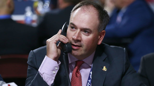 VANCOUVER, BRITISH COLUMBIA - JUNE 22: General manager Pierre Dorion of the Ottawa Senators talks on the phone on the draft floor during Rounds 2-7 of the 2019 NHL Draft at Rogers Arena on June 22, 2019 in Vancouver, Canada.