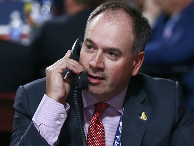 VANCOUVER, BRITISH COLUMBIA - JUNE 22: General manager Pierre Dorion of the Ottawa Senators talks on the phone on the draft floor during Rounds 2-7 of the 2019 NHL Draft at Rogers Arena on June 22, 2019 in Vancouver, Canada.
