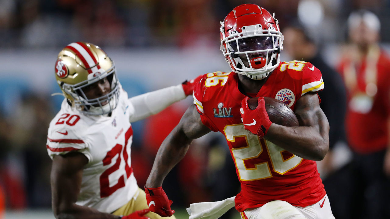 MIAMI, FLORIDA - FEBRUARY 02: Damien Williams #26 of the Kansas City Chiefs gives a stiff arm to #20 of the San Francisco 49ers during the fourth quarter in Super Bowl LIV at Hard Rock Stadium on February 02, 2020 in Miami, Florida.