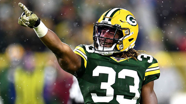 GREEN BAY, WISCONSIN - NOVEMBER 10: Aaron Jones #33 of the Green Bay Packers celebrates a first down against the Carolina Panthers during the third quarter in the game at Lambeau Field on November 10, 2019 in Green Bay, Wisconsin.
