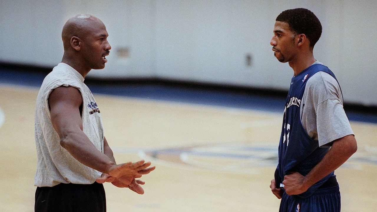 WASHINGTON, : Washington Wizard basketball co-owner Michael Jordan (L) gives instruction to Wizard Richard Hamilton during a round of practice at the MCI Center 31 January 2000 in Washington, DC. Jordan, who as a player led the Chicago Bulls to six NBA titles in eight years, may face his biggest challenge yet with the Wizards, an underachieving franchise that has made the playoffs just once in 12 years. The club is last in the Atlantic Division and hasn't sold out a home game this season. AFP PHOTO/Mario TAMA
