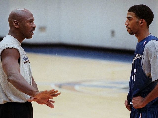WASHINGTON, : Washington Wizard basketball co-owner Michael Jordan (L) gives instruction to Wizard Richard Hamilton during a round of practice at the MCI Center 31 January 2000 in Washington, DC. Jordan, who as a player led the Chicago Bulls to six NBA titles in eight years, may face his biggest challenge yet with the Wizards, an underachieving franchise that has made the playoffs just once in 12 years. The club is last in the Atlantic Division and hasn't sold out a home game this season. AFP PHOTO/Mario TAMA
