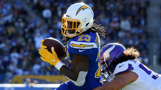 CARSON, CALIFORNIA - DECEMBER 15: Melvin Gordon #25 of the Los Angeles Chargers attempts to get around Eric Kendricks #54 of the Minnesota Vikings during the second quarter at Dignity Health Sports Park on December 15, 2019 in Carson, California.